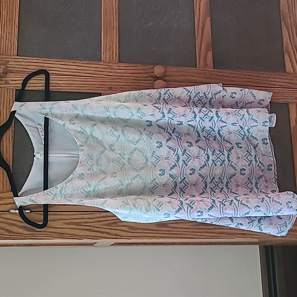 Cabi xl summer top..sleeveless..two different patterns..shown..lined with white.